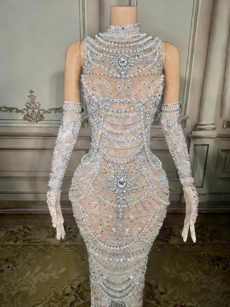 Beaded White Mermaid Gown – High-Neck Sleeveless Style Featuring Open Back Detail and Floor-Sweeping Hemline